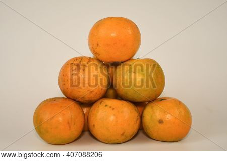 A Plie Of Sweet Orange On White Background