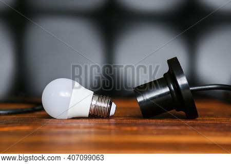 Unscrewed Lamp Near To A Cartridge For A Lamp. Lack, Power Outage. Electricity Is Not Supplied To Th