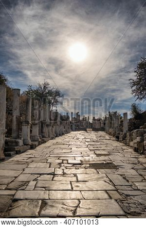 Historic marble slabs of the Curetes street in Ephesus Ancient City at sunny day in Selcuk, Turkey. Ancient and historical road from the roman period.