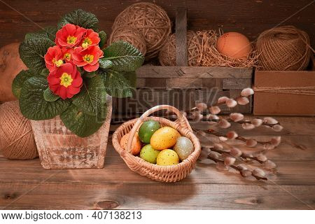 Easter Eggs In Wattle Basket. Primrose Flowers And Bunch Of Pussy Willow Twigs. Vintage Rustic Inter