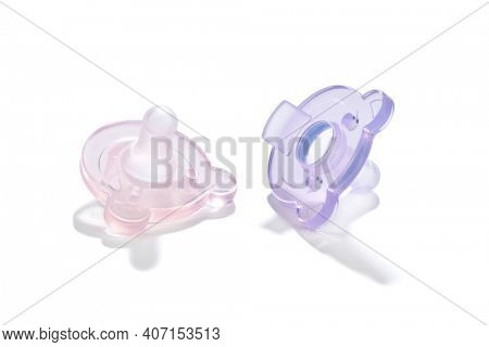 Pacifiers for newborn baby girls' isolated on white background   