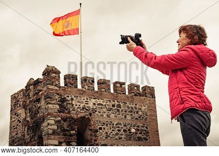 Tourist Woman With Camera Taking Travel Picture On Sohail Castle In Fuengirola, Malaga Spain. Touris