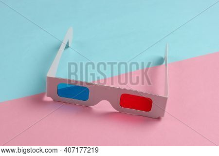 Stereoscopic Anaglyph Disposable Paper 3d Glasses On Blue Pink Background. Top View