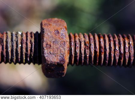 Rusty Nut. Rusty Iron Rod With Screw Threads. Rusted Mechanical Components. Threaded Bolt And Nut Is
