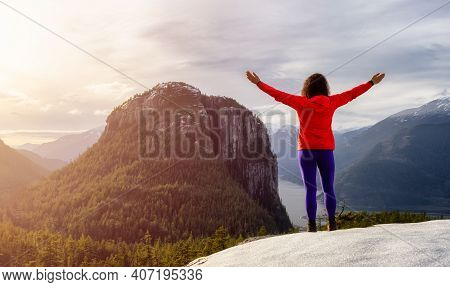 Adventurous Girl Hiking In The Mountains During A Sunny Autumn Sunset. Taken In Squamish, North Of V