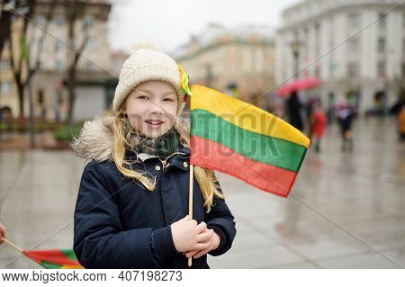 Cute Young Girl Celebrating Lithuanian Independence Day Holding Lithuanian Flag In Vilnius, Lithuani