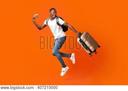 Bye-bye, Im Going Vacation. Young Happy Black Man With Suitcase, Backpack, Passport And Flight Ticke
