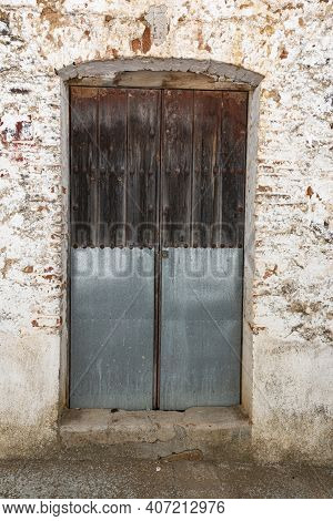 Old Door In A Town House Of Andalusia In Spain