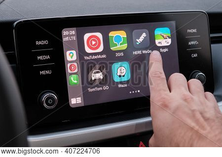 Close Up Mans Hand Select The Application Of Navigation Or Maps On The Car Dashboard. January 2021, 