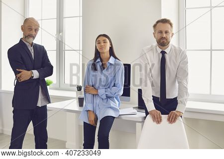 Group Of Business People Colleagues Looking At Camera In Office During Startup Or Project Discussion