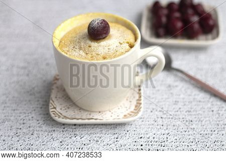 Vanilla Cupcake With Cherries In A Mug. Delicious Sweet Dessert