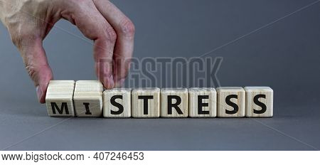 Mistress Or Stress Symbol. Businessman Turns Wooden Cubes And Changes The Word 'mistress' To 'stress