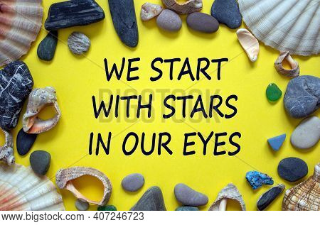 Text 'we Start With Stars In Our Yeys' On A Beautiful Yellow Background. Sea Stones And Seashells. T