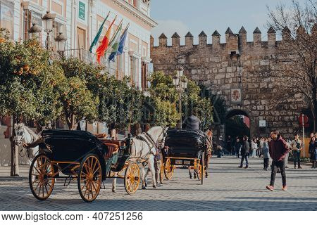 Seville, Spain - January 19, 2020: Horse Carriage City Tour On Plaza Del Triunfo, Small Plaza And Po