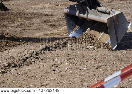 An Excavator Carries Out Excavation Work On A Construction Site