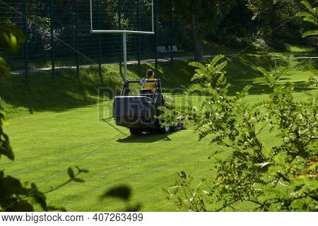 Care Of The Football Field On A Lawn Mower