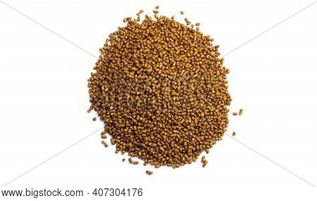 Buckwheat Tea On A White Background. Isolate. Buckwheat Tea Close-up Macro Photography. Scattered Bu