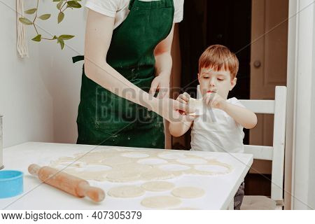 Little Boy Helps Mother To Cook  Making Homemade Coockies. Casual Lifestyle In Home Interior, Pretty