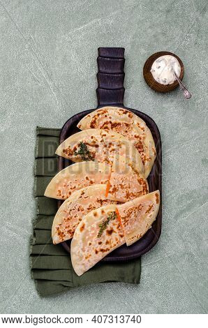 Baked Bread With Vegetable Filling On A Stone Background. Selective Focus.