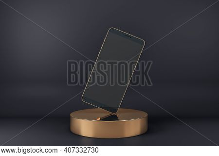 Blank Black Smartphone Display Standing On One Corner On Golden Cylinder At Abstract Dark Background