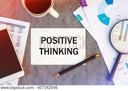 Positive Thinking Is Written In A Document On The Office Desk With Office Accessories, Coffee, Diagr