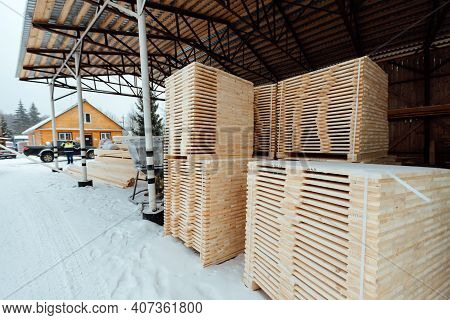 Warehouse Of Wooden Boards, Background Texture Of Wood Harvested For Shipment To The Factory, Finish