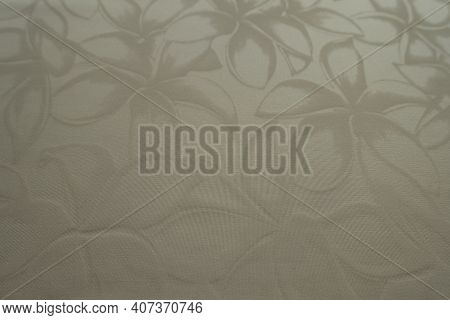 Close View Of Glossy Cream Colored Polyamide Fabric With Floral Pattern