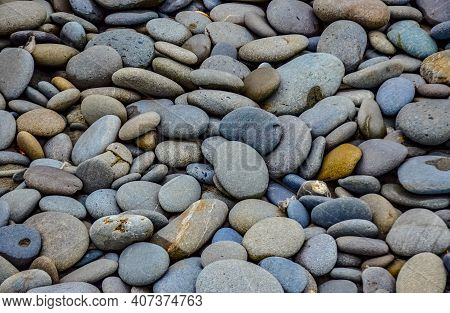 Multicolored Round Pebble Stones On The Pacific Ocean In Olympic National Park, Washington