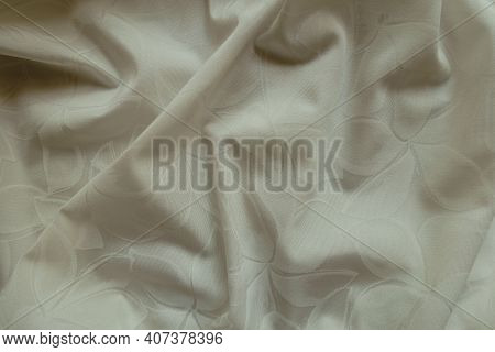 Rippled Glossy Cream Colored Polyamide Fabric With Floral Pattern