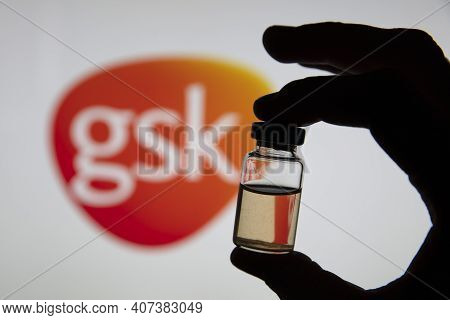 Oxford, Uk - February 2020: Glaxosmithkline Logo With A Bottle Of Covid Vaccine