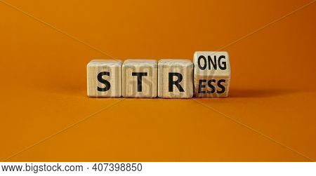 Strong Stress Symbol. Turned Wooden Cubes With Words 'strong Stress'. Beautiful Orange Background, C
