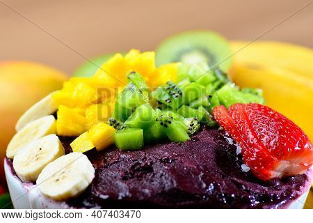Acai Bowl With Fruits Salad Banana Mango Kiwi And Strawberry, Delicious Açaí Brazilian Cream Dessert