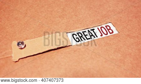 The Text Great Job Appearing Behind Torn Brown Paper