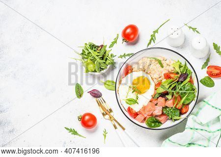 Savory Breakfast. Oatmeal Porrige With Salted Salmon, Egg And Fresh Salad. Healthy Food, Balanced Nu