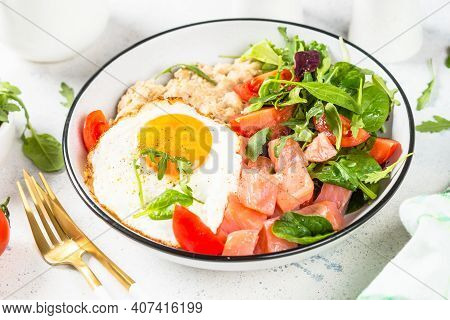 Savory Breakfast. Oatmeal Porrige With Salted Salmon, Egg And Fresh Salad. Healthy Food, Balanced Nu