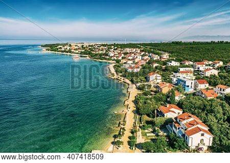 Aerial Top View Of Village Petrcane, Croatia. Touristic Background With Blue Sea, Coastline And Red 