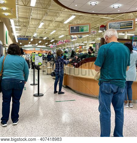 People Waiting In Line To Purchase Lottery Tickets At A Publix Grocery Store