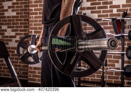Fitness Man Doing Exercises In The Gym. Fitness And Healthy Lifstyle Concept