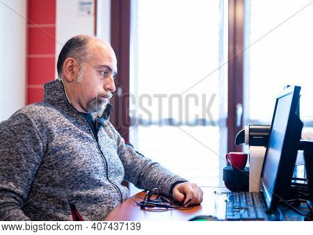 A Middle Aged Caucasian Man Working From Home, Is Pissed Off And Feels Isolated. Concept Of Stressfu