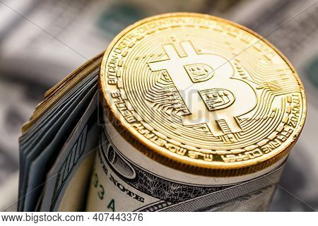 Golden Bitcoin Lies On The Banknotes.new Virtual Money. Crypto Currency Top View. Real Coins Of Bitc