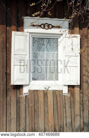 Window With Carved Wooden Shutters In A Russian House