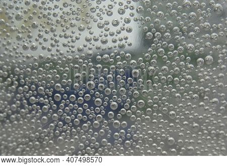 Air Bubble. Background Of Small Bubbles On The Glass