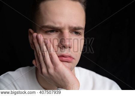 Young Sad Guy, Teenager Holding His Cheek, Toothache, Problems