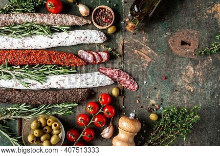 Spanish Dry Cured Sausages Salami, Fuet And Chorizo On A Wooden Background. Banner, Catering Menu Re