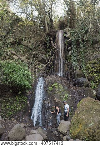 Lomo Magullo, Gran Canaria, Canary Islands, Spain December 25, 2020: Small Waterfall At Lush Landsca