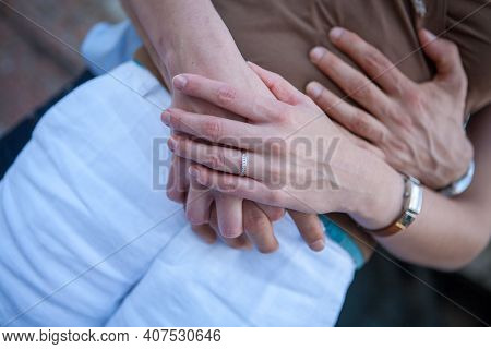 Loving Couple Holding Hands Close-up. Love Concept. High Quality Photo