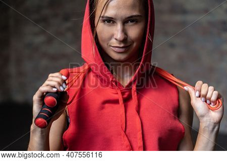 Closeup Portrait Pretty Smiling Sporty Young Woman In Red Hoody Sportswear Hold Skipping Jumping Rop
