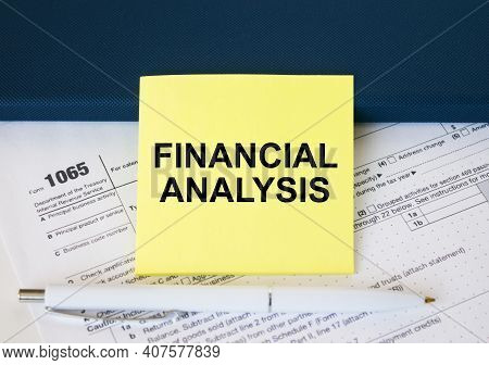 Tax Form 1065 With Yellow Sticker With Text Financial Analysis. Notepad And White Pen