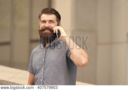 Social And Communicative Skills. Happy Hipster Talk On Mobile Phone Outdoors. Mobile Communication. 