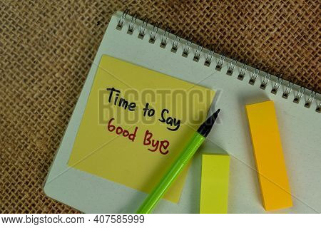 Time To Say Good Bye Write On Sticky Notes Isolated On Wooden Table.